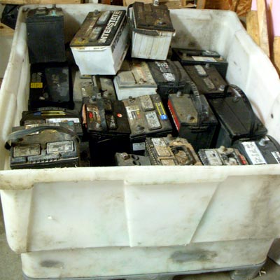 Bin of old automotive batteries getting ready to be recycled